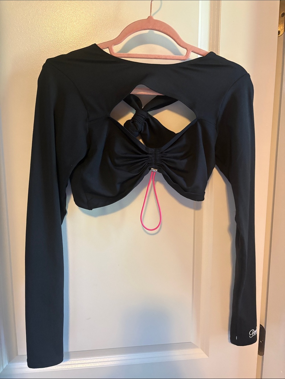Bombshell Sportswear Black Long-Sleeve Crop Top with Open Back Twist